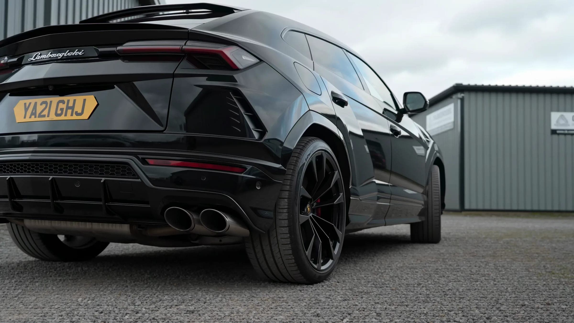 A Lamborghini Urus parked between the units at Cardiff Marine Village