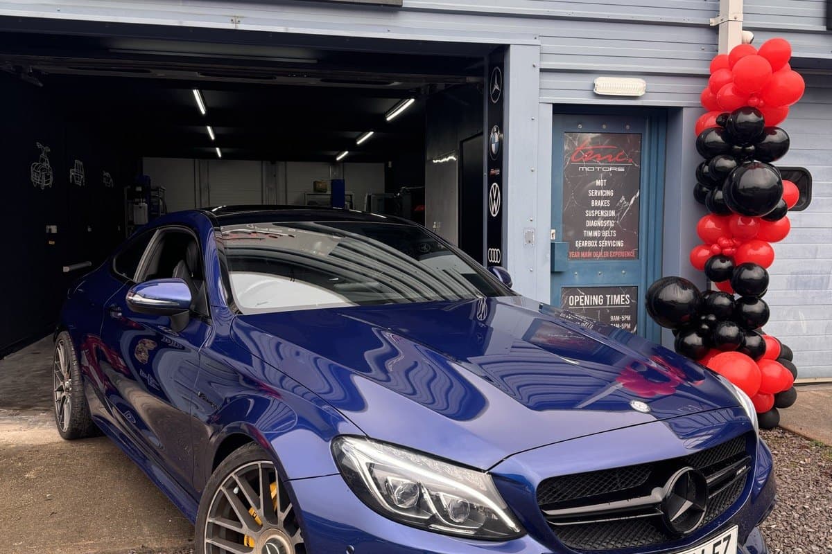 A Mercedes-AMG C-Class outside the Team Mercedes Cardiff workshop