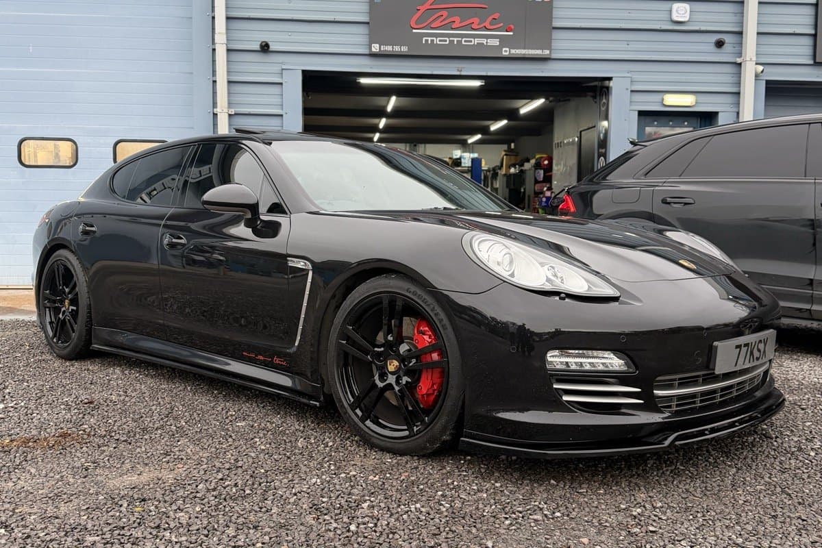 A Porsche Panamera outside the Team Mercedes Cardiff workshop