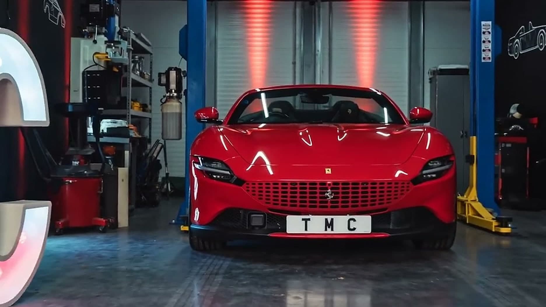 A car between the two-post lifts inside the Team Mercedes Cardiff workshop