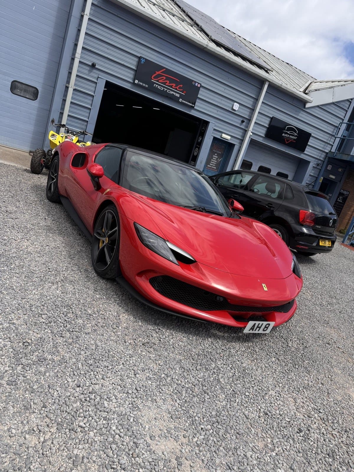 A red Ferrari outside the Team Mercedes Cardiff workshop
